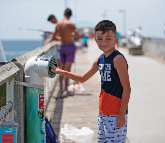 Young Angler Recylces Fishing Line In One Cba S Recycling Bins Located On Okaloosa Island Pier.