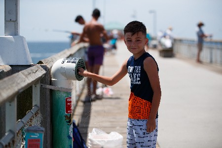 Young Angler Recylces Fishing Line In One Cba's Recycling Bins Located On Okaloosa Island Pier.