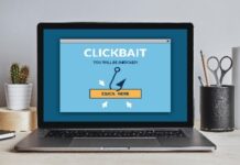 Clickbait Concept On Laptop Screen On Modern Desk